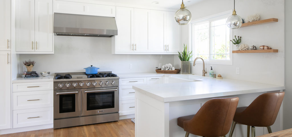 A clean, white kitchen design by Breegan Jane