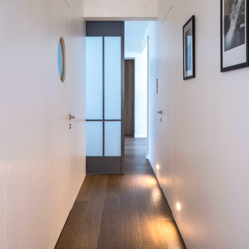 A hallway lined with photography