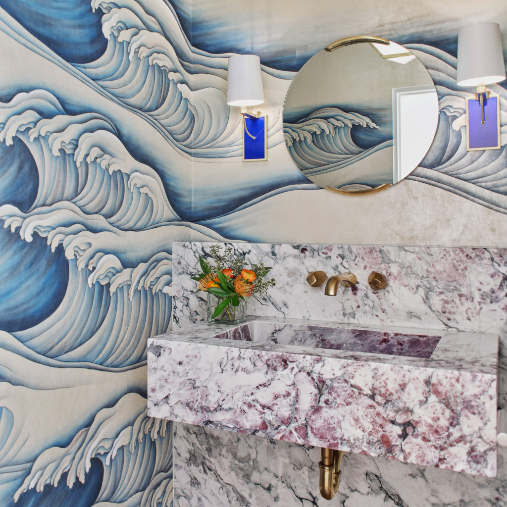 The powder room with wave-patterned wallpaper