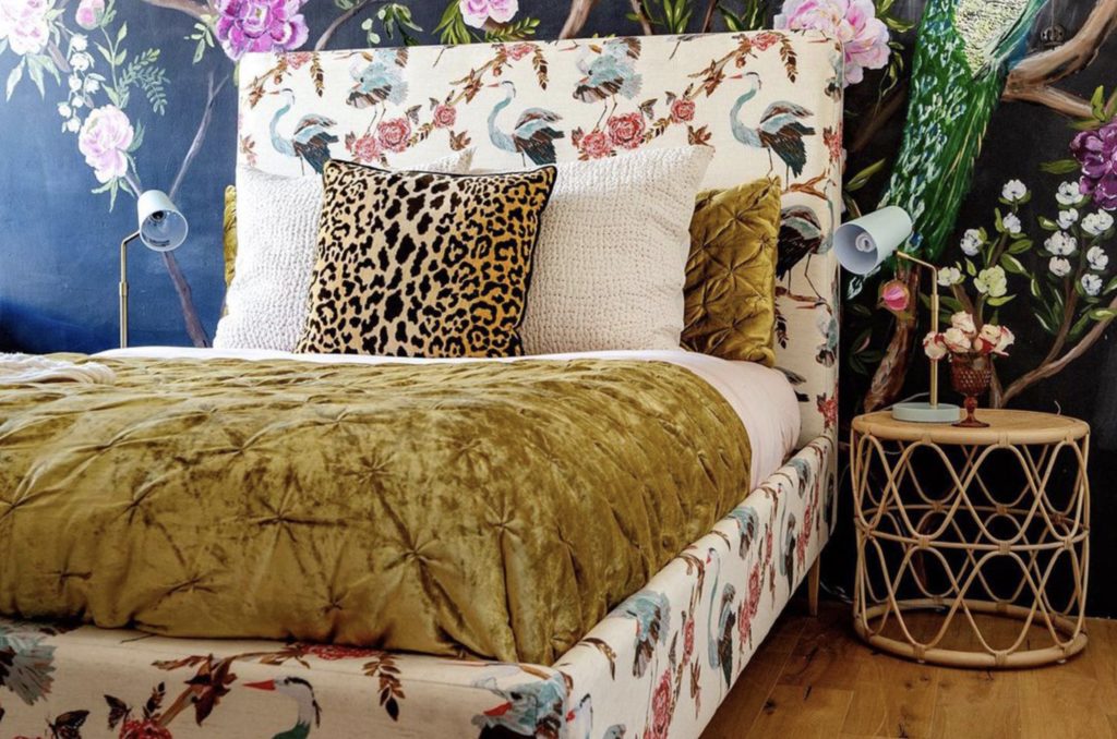 Joybird x Bari J. Heron Jardin "Oliff" bed paired with floral wallpaper and a leopard print pillow