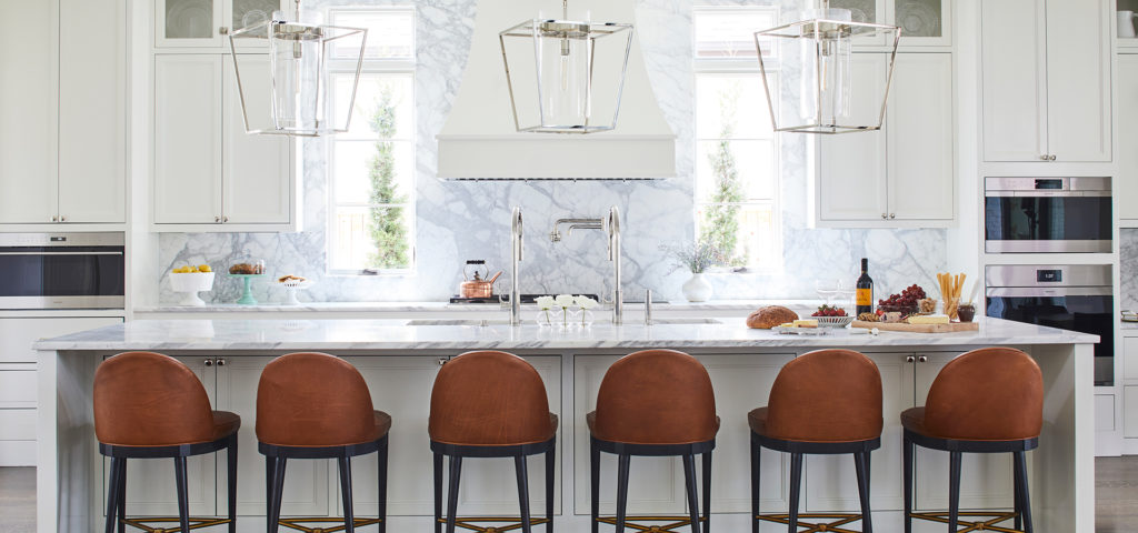 The classic and clean kitchen with leather barstools