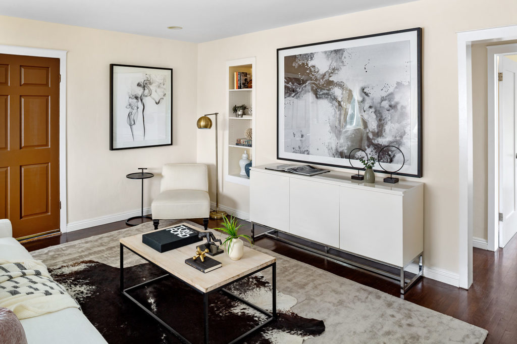 Light walls, fresh artwork, and a clean palette attracts buyers post-staging